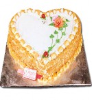 send 1 Kg Eggless Butterscotch Cake Heart Shaped delivery