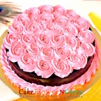 send half kg pink roses chocolate cake delivery