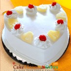 send half kg heart shaped pineapple cake  delivery