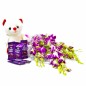 purple orchids with teddy and dairy milk