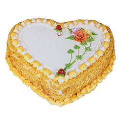 send 1Kg Eggless Heart Shape Butterscotch Cake delivery