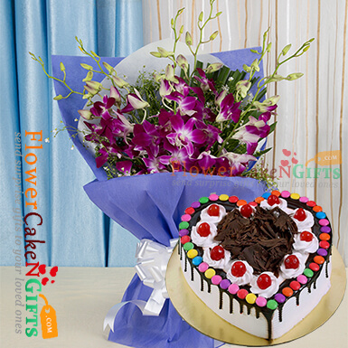send half kg black forest gems heart shape cake and orchid bouquet delivery
