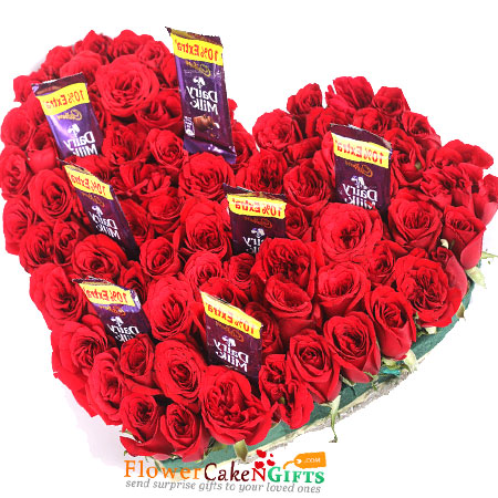 75 red roses 7 dairy milk chocolates heart shaped arrangement
