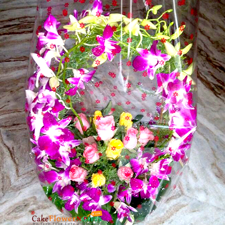 send 16 roses 7 purple orchids basket delivery