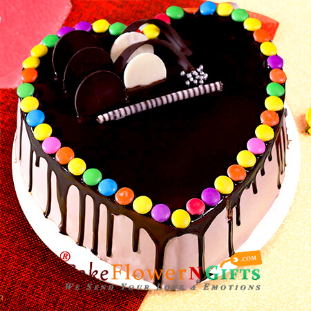 send 1kg chocolate gems heart shape cake delivery