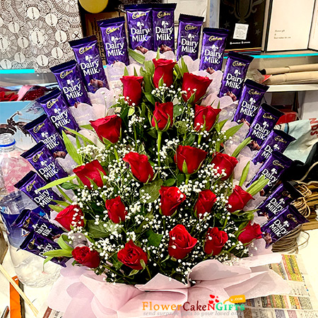 send 20 Dairymilk Chocolates 20 Red Roses Basket Arrangement delivery